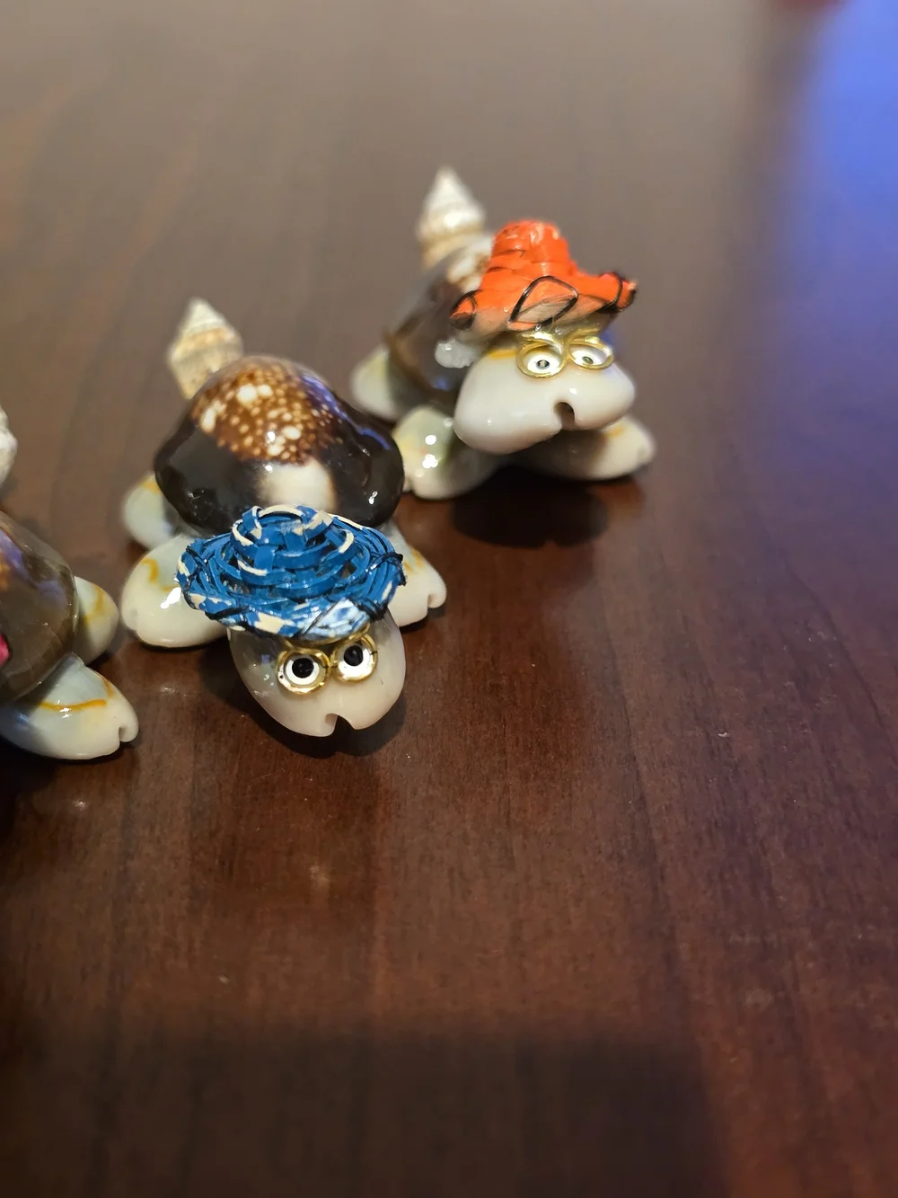 Four Cute Handmade Mini Turtles Made From Seashells with Glasses and Straw Hats